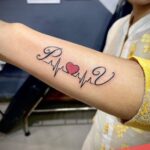 iniciales tattoo